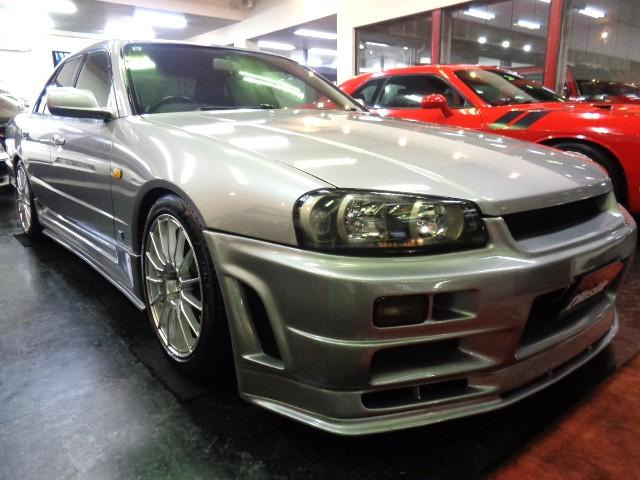 R34スカイラインGTソニックシルバーMカラー4Dセダンボディ%R34GTRVスペックNISMO仕様エアロ&RB20DENEO6エンジン純正5MTマフラー車高調他装備充実車が入庫しました