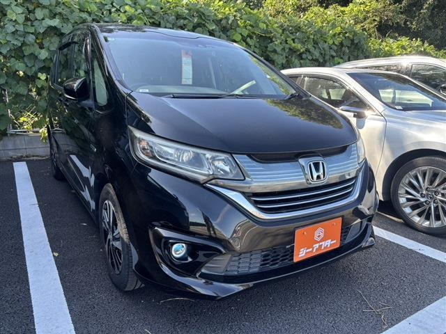 フリード(ホンダ) 1.5 ハイブリッド EX　禁煙車 ブラックハーフレザーシート 中古車画像